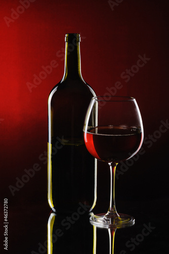 Special red wine bottle with glass