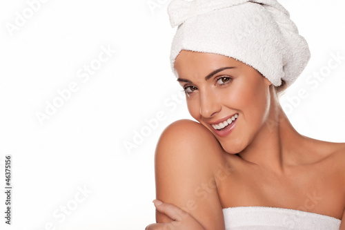 Beautiful woman wrapped in bath towels