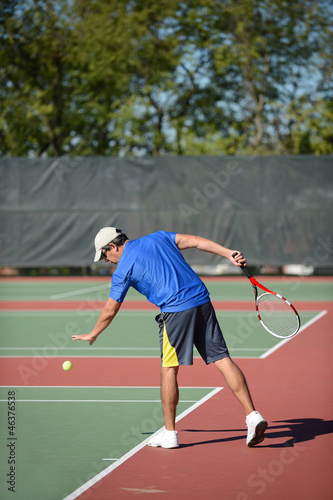 Mature Man Playing Tennis