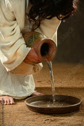 Jesus Pouring Water into Container