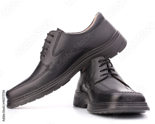 Black glossy man’s shoes with shoelaces