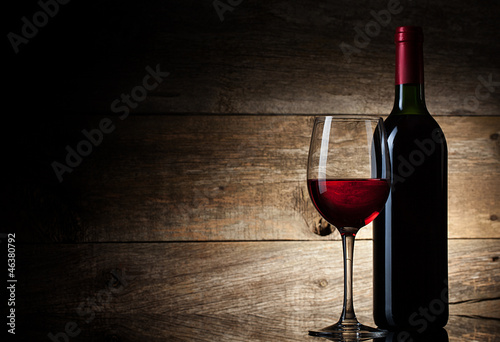 Wine glass and Bottle on a wooden background #46380792