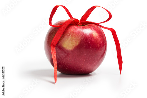 single red apple with ribbon bow
