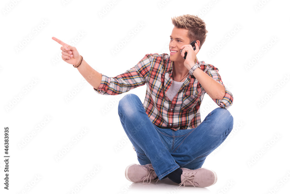 man sitting and pointing man sitting and pointing
