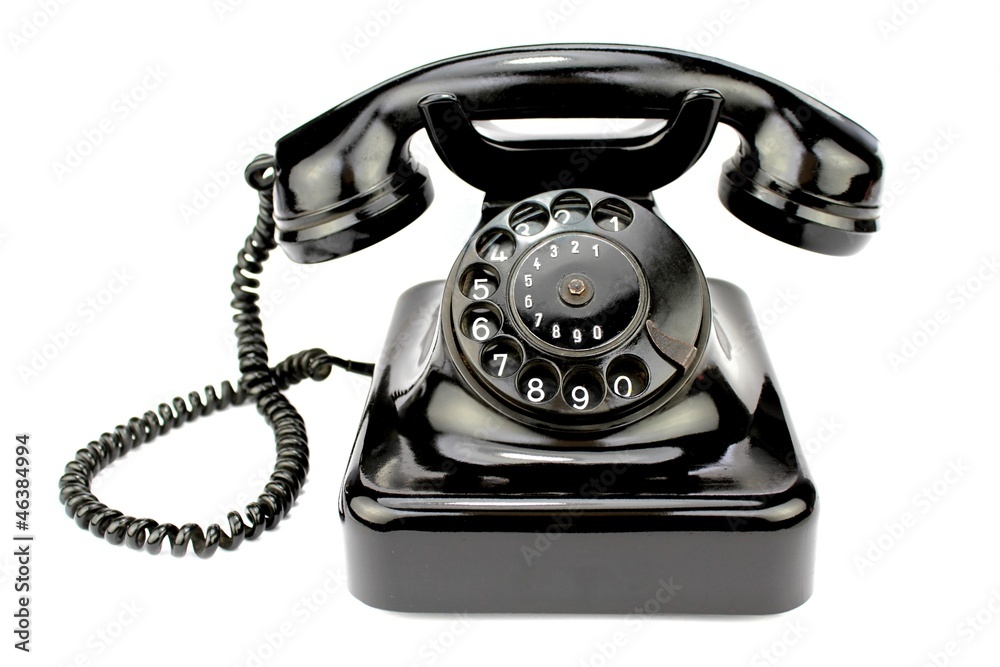 Old rotary phone on white background. Old rotary phone on white background.