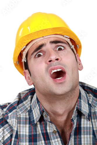 A horrified tradesman