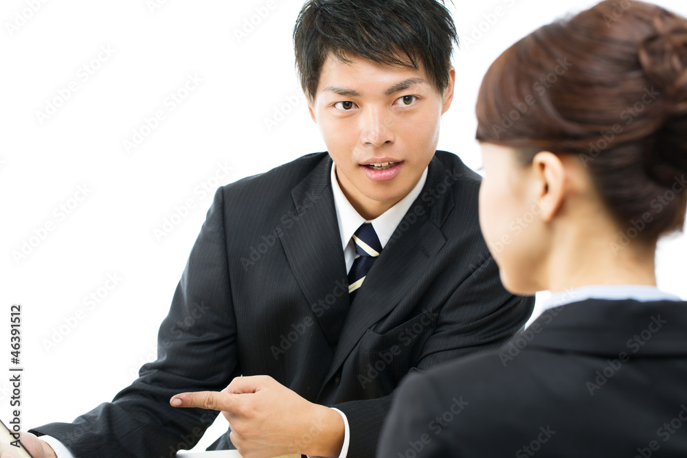 Young asian smiling businesswoman and businessman Young asian smiling businesswoman and businessman