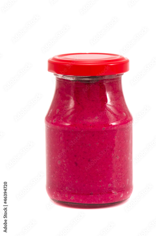 preserved horseradish in glass jar on white preserved horseradish in glass jar on white