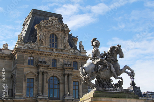 Louis XIV statue with Louvre palace