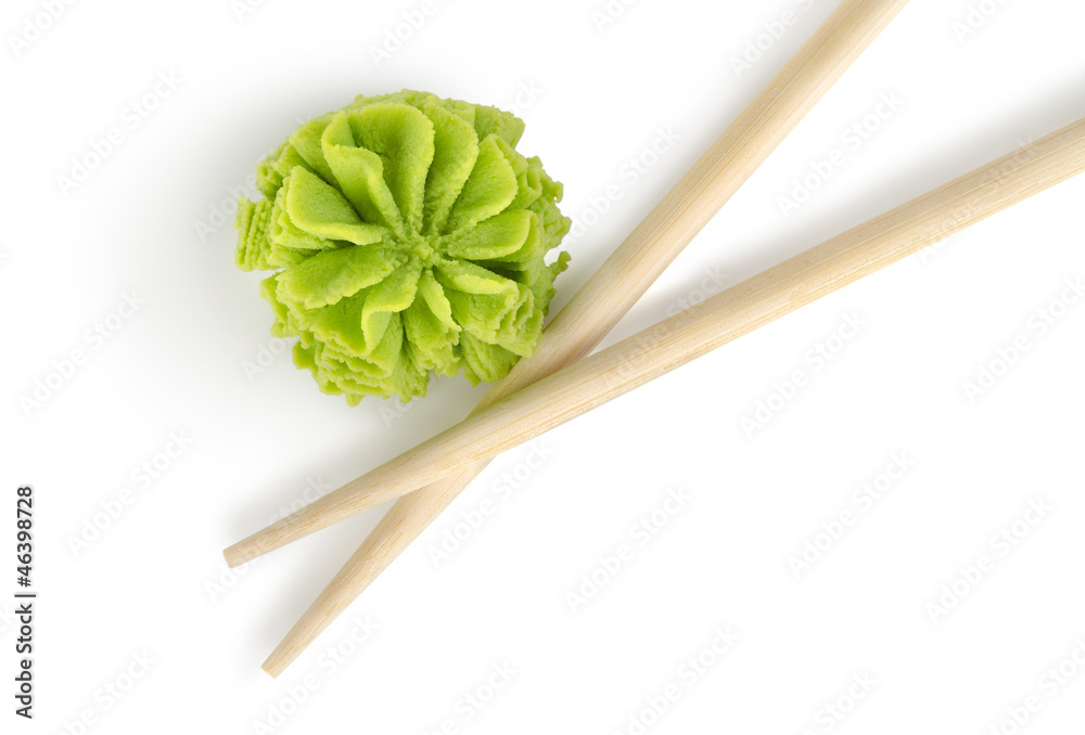 Wooden chopsticks and wasabi isolated