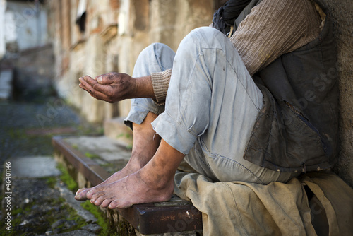 Beggar is begging for food on the street photo