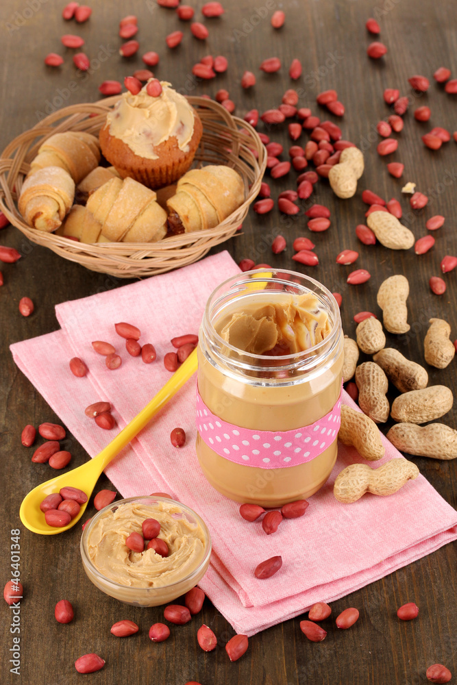 Delicious peanut butter in jar with baking Delicious peanut butter in jar with baking