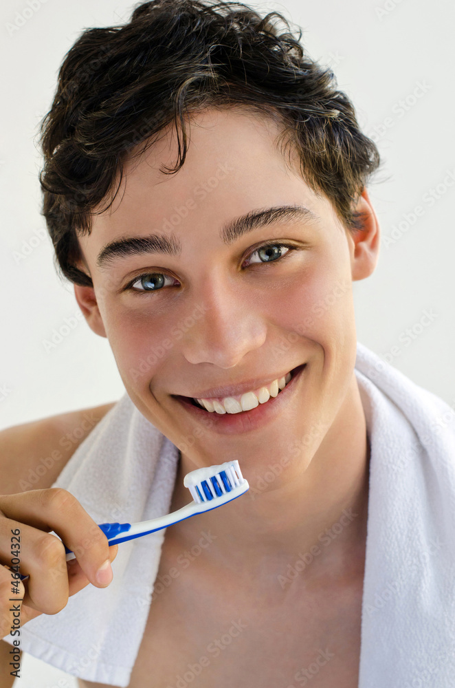 Handsome man smiling and holding a toothbrush Handsome man smiling and holding a toothbrush