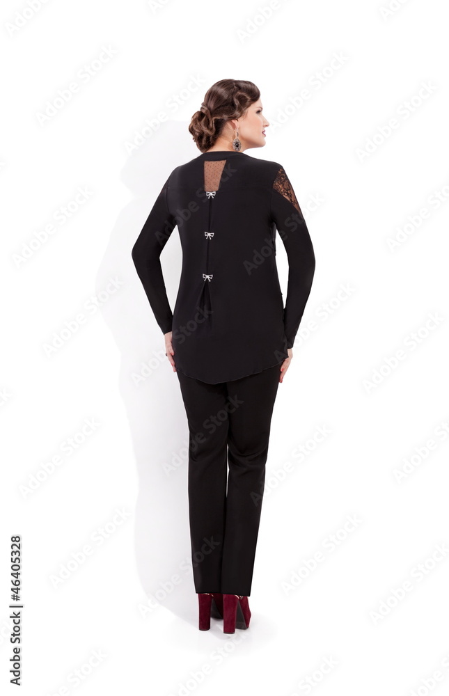 Fototapeta premium Beautiful woman in black next to white