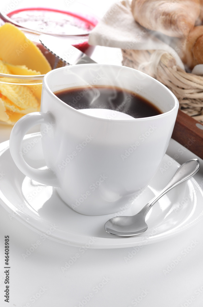 Breakfast of coffee, croissant, jam and butter Breakfast of coffee, croissant, jam and butter