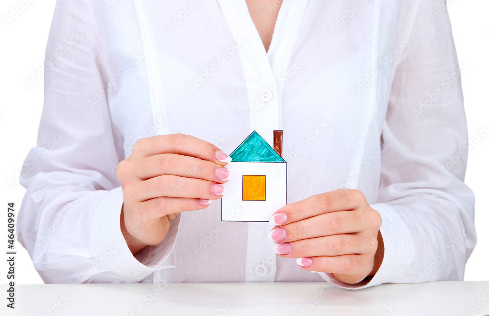 concept: woman hands with paper house, close up concept: woman hands with paper house, close up