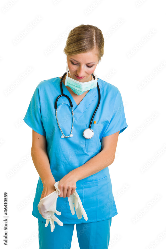 Woman in doctor uniform wearing latex gloves Woman in doctor uniform wearing latex gloves
