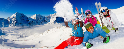 Ski, snow, sun and winter fun - happy family ski team #46425382
