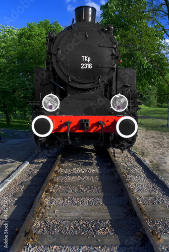 Vintage steam engine locomotive train on railroad track