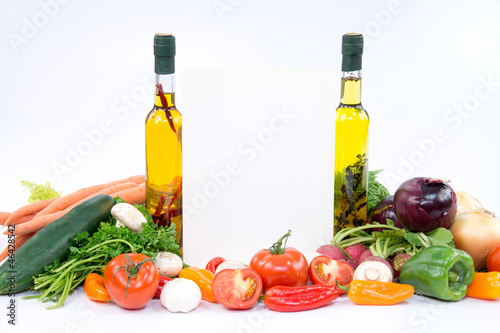 Fototapeta Naklejka Na Ścianę i Meble -  Papre for recipes between olive oil bottles and vegetable