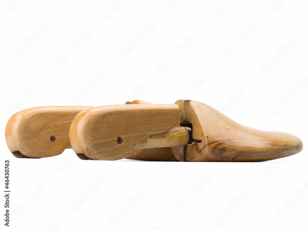 Close up wooden shoe stretcher isolated on white background