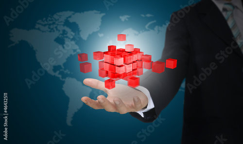 Hand of business Man holding 3d cube made of glass block