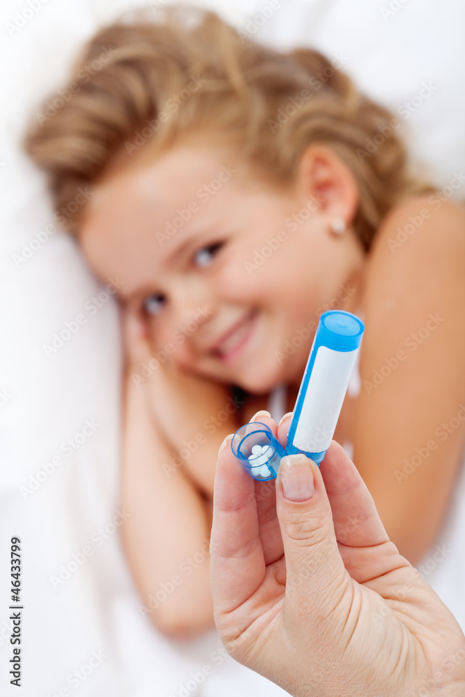 Little girl receiving homeopathic medication Little girl receiving homeopathic medication