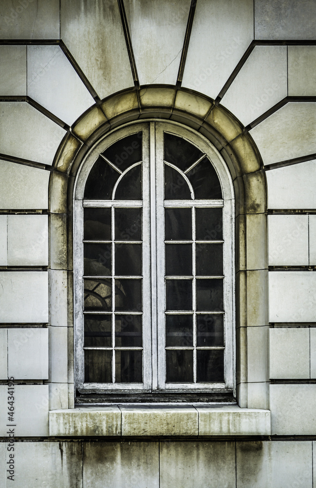 Aged arch white window
