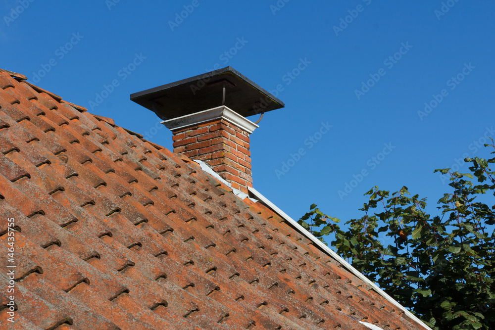 Roof and chimney on old house
