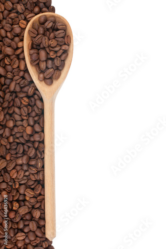 Wooden spoon with coffee grains