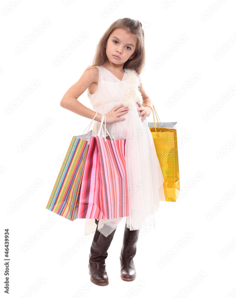 Beautiful little girl with shopping bags