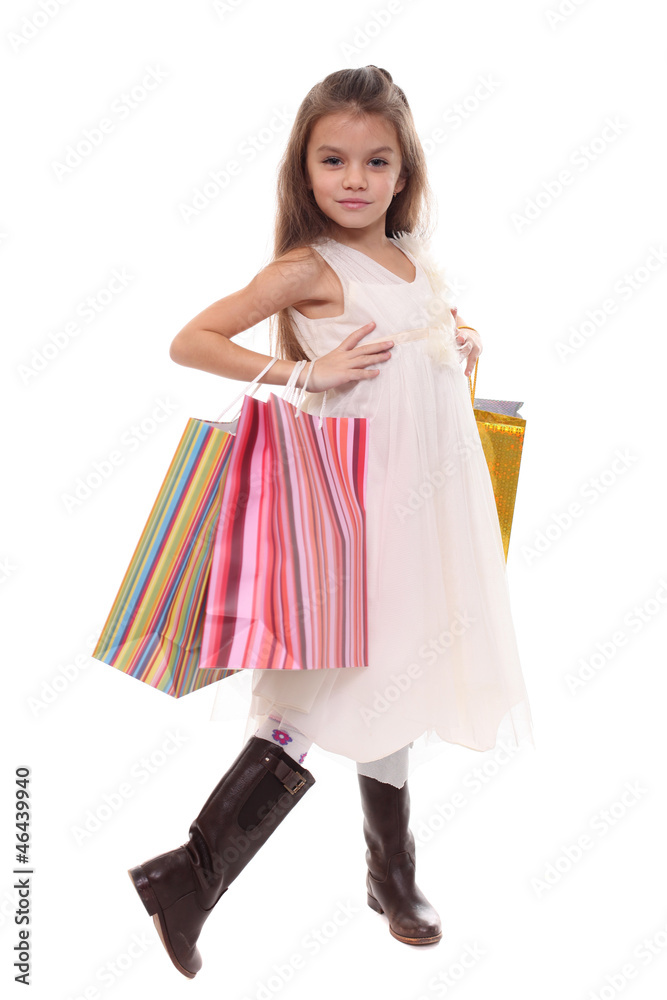 Beautiful little girl with shopping bags Beautiful little girl with shopping bags