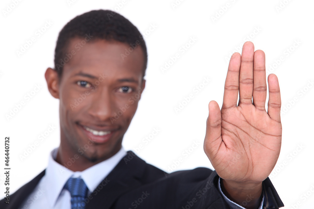 Businessman holding his hand in a stop gesture Businessman holding his hand in a stop gesture