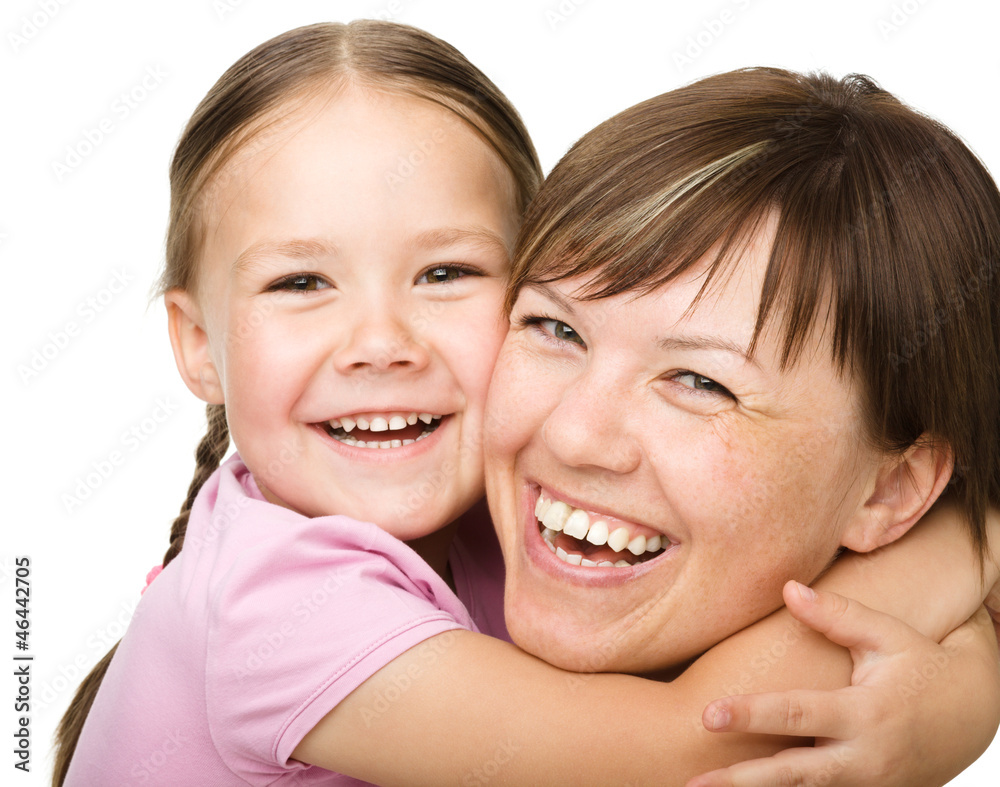 Portrait of a happy mother hugging her daughter Portrait of a happy mother hugging her daughter