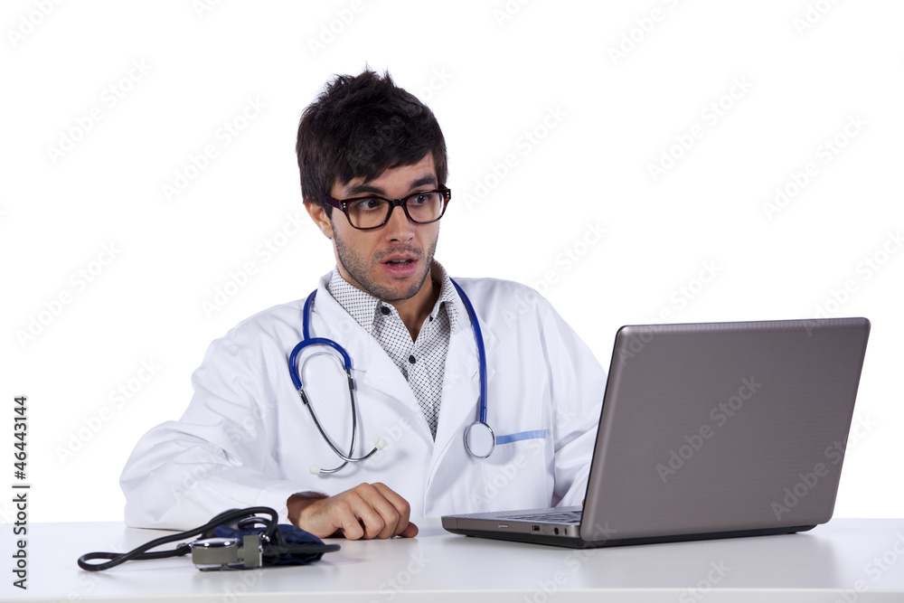 frendly young doctor working with his laptop frendly young doctor working with his laptop