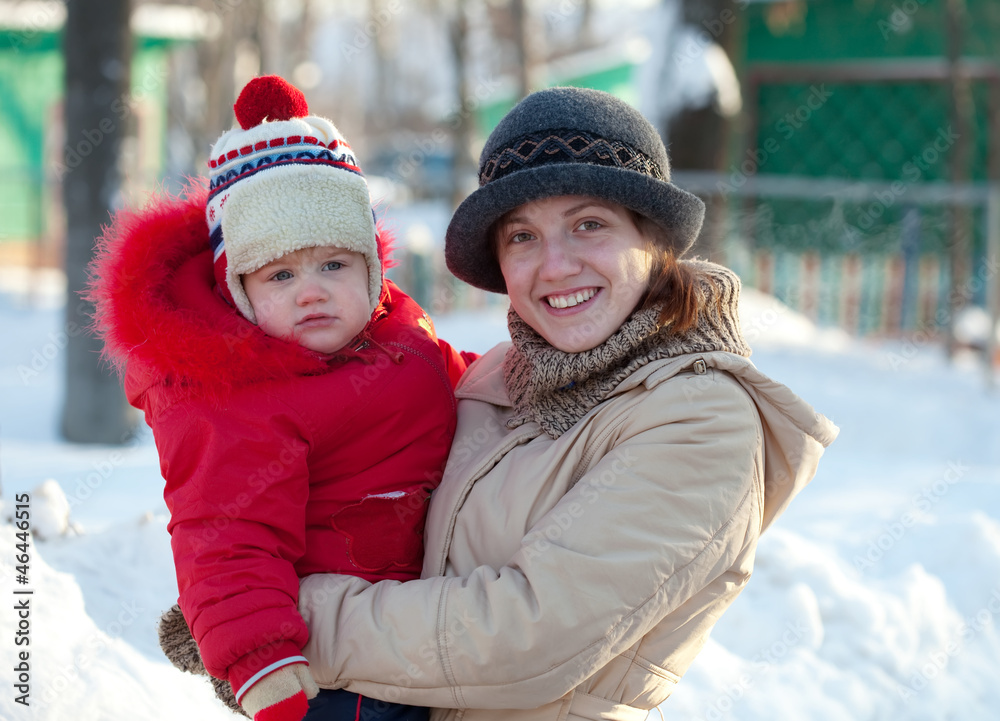 Fototapeta premium happy mother with toddler in winter