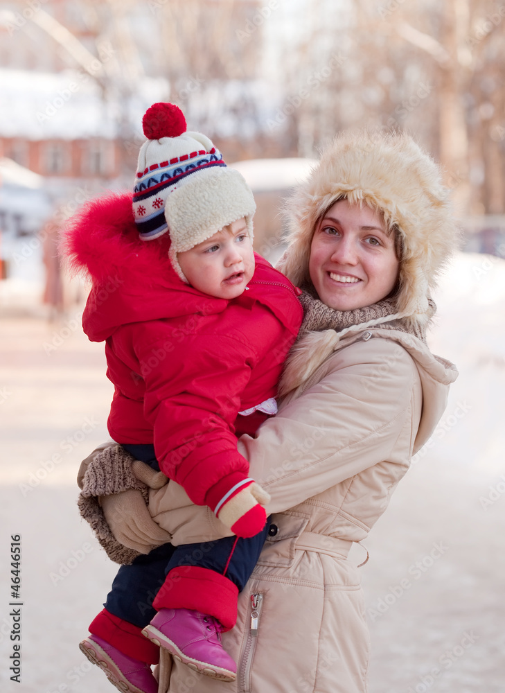 Fototapeta premium happy mother with toddler in winter