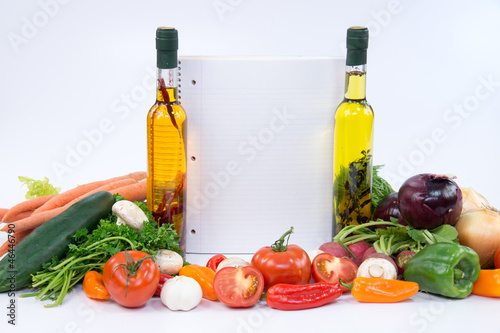 Fototapeta Naklejka Na Ścianę i Meble -  White board between olive oil bottles and vegetable