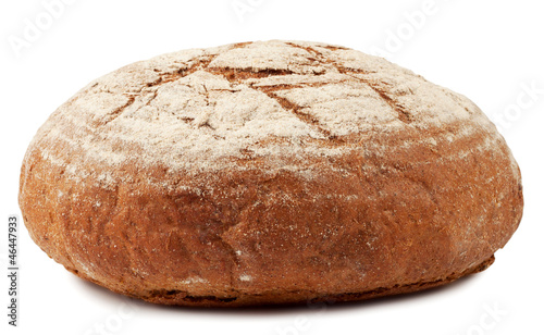 A loaf of bread dusted with flour isolated on white background