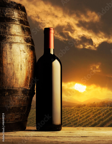 red wine bottle at sunset