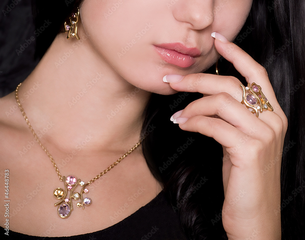 Portrait of beautiful young woman with jewelry