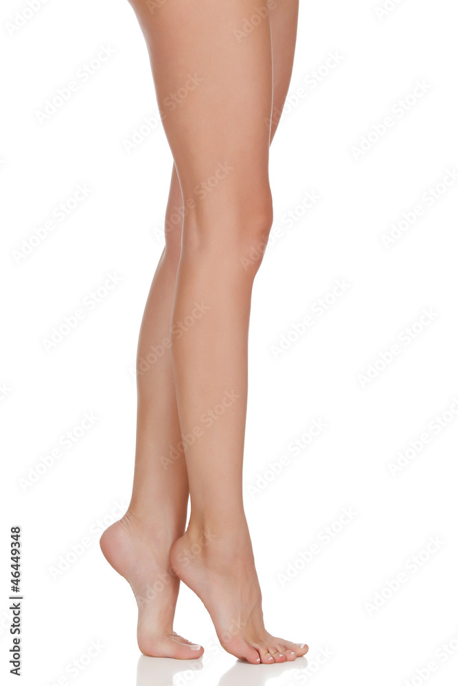 Beautiful woman legs against white background