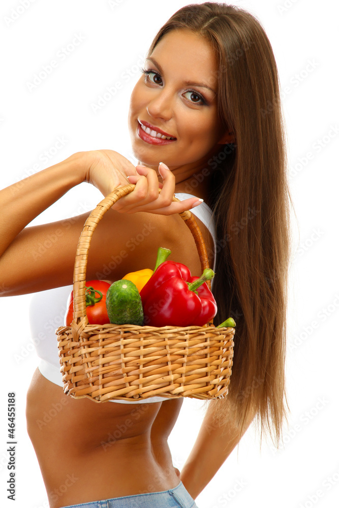 beautiful young woman with vegetables in basket, isolated beautiful young woman with vegetables in basket, isolated