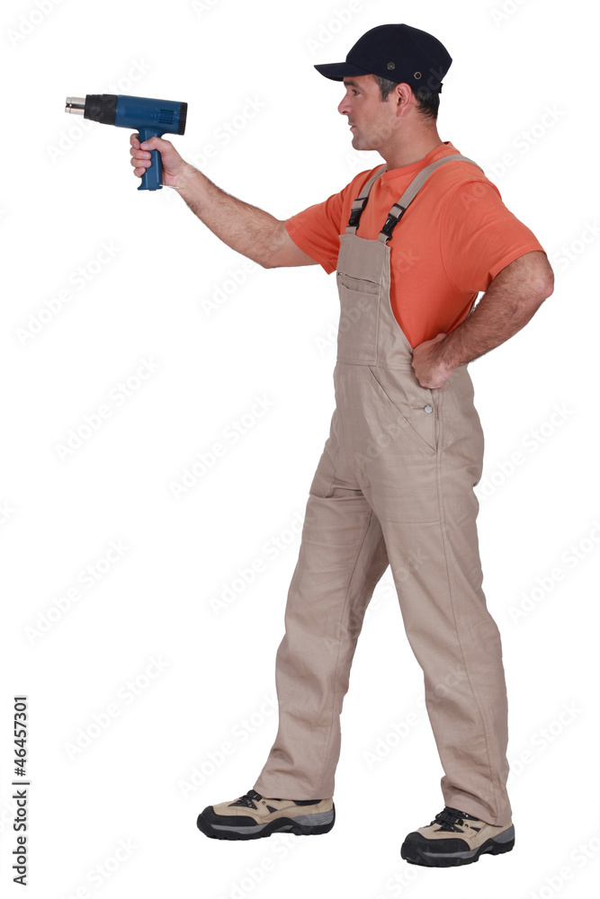 Laborer using drill on white background Laborer using drill on white background