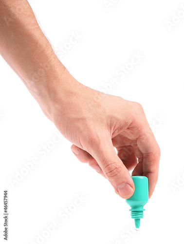 hand with eye drop bottle