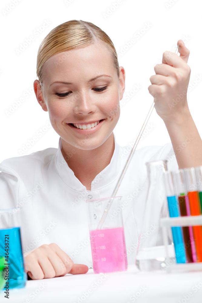 Female lab assistant is surrounded by medical vials and flasks Female lab assistant is surrounded by medical vials and flasks