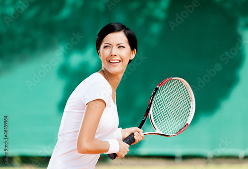 Portrait of successful tennis player with racket © Karramba Production