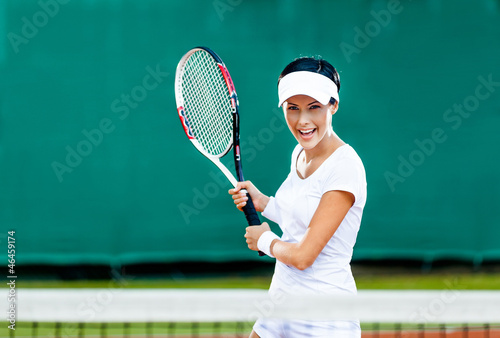 Woman in sportswear plays tennis at competition © Karramba Production