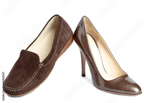 Female shoes without and with heel on a white background..