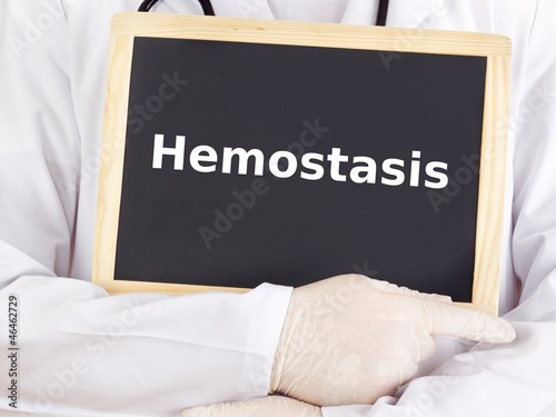 Doctor shows information on blackboard: hemostasis photo